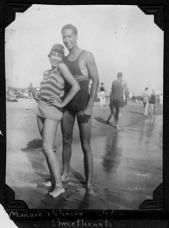 Sweethearts Margie Johnson and John Pettigrew at the crowded Pacific Ocean shoreline in 1927. This photograph and others at Bruce’s Beach were featured under the title of this caption on a page in the scrapbook of LaVera White who lived in Los Angeles.