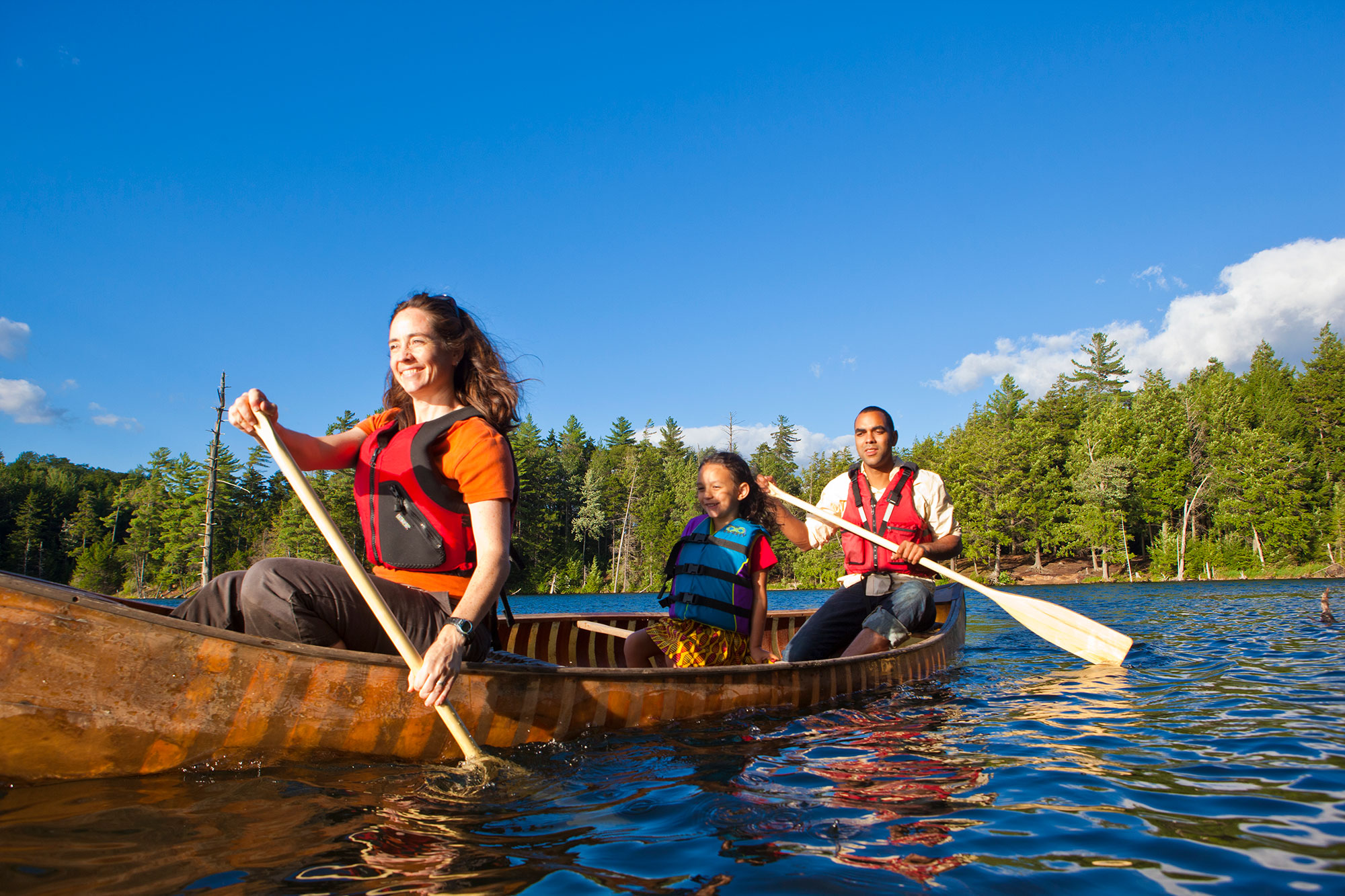 A group of people in a canoe.