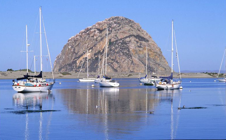 Boats anchored in Morro Bay with Morro Rock in the background