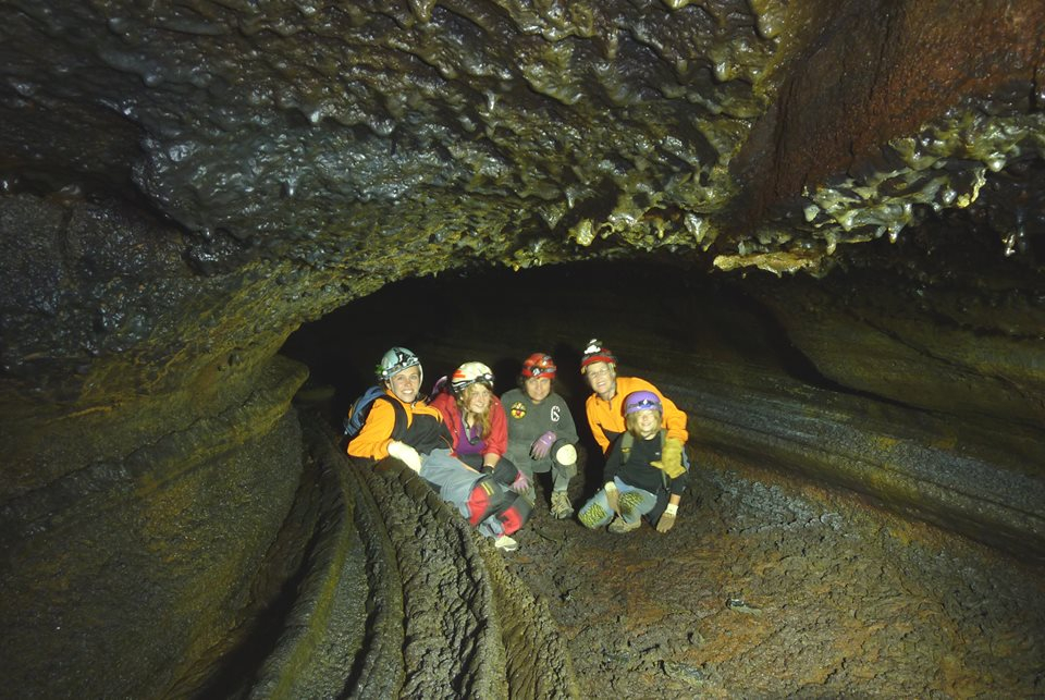 Cavers gather in a lava tube
