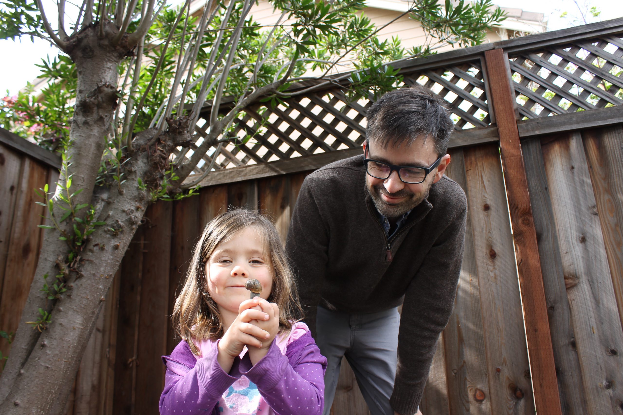 Nathanael Johnson and his daughter, holding a snail