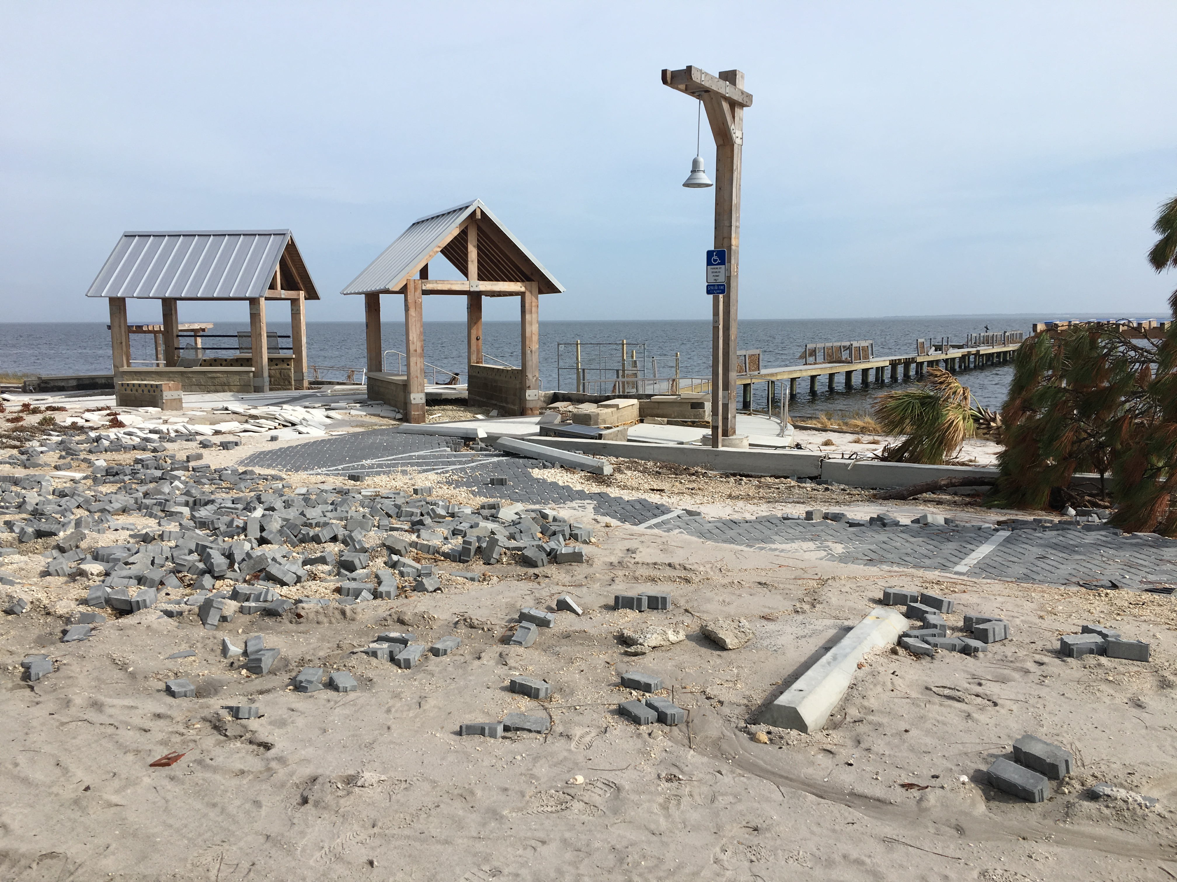 Two damaged pavilions at Island View Park after Hurricane Michael