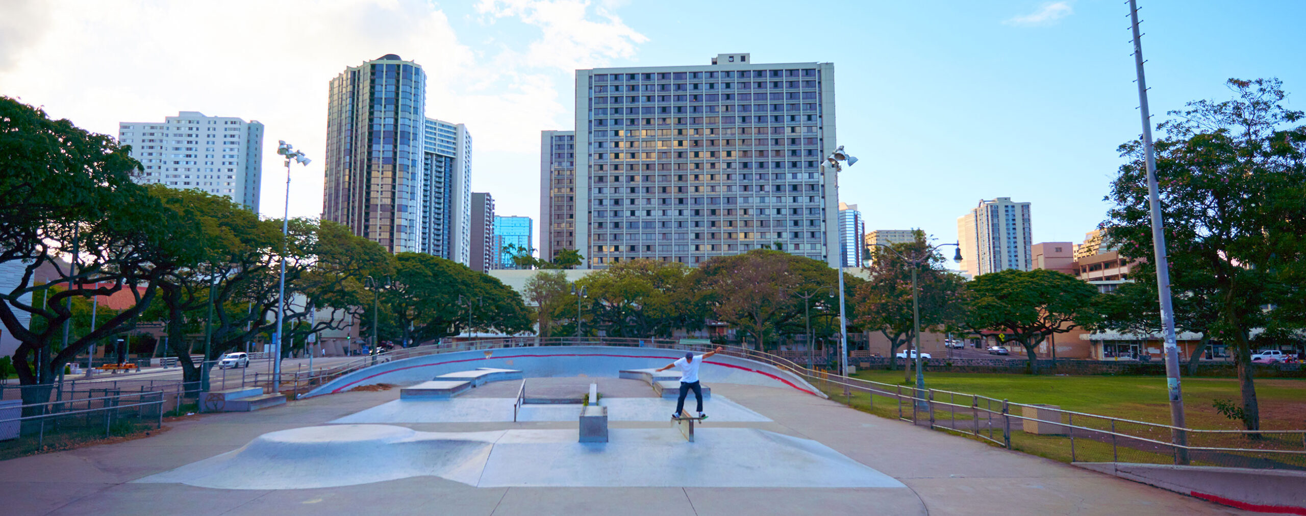 A skateboarder is riding a skateboard in a skate park.