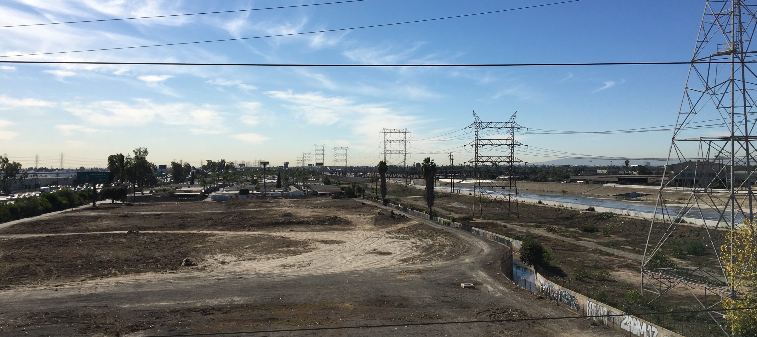 A view of a construction site with power lines.