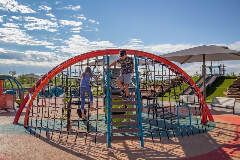A children's playground with a climbing structure.