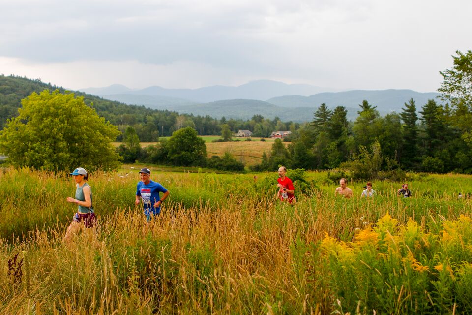 Runners make their way through the Williston Community Forest in Vermont.