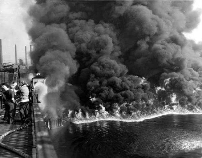 1952 archive photo of a fire on the surface of the Cuyahoga River