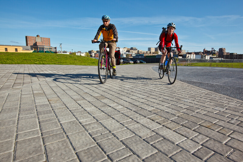 Two cyclists on Portland Bayside Trail in Maine.