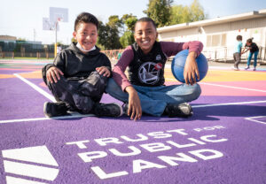 Students take a basketball break at Markham Elementary School in Oakland, California, where Trust for Public Land transformed a concrete schoolyard into a vibrant play space with a soccer field and 75 new trees.Photo: Amy Osborne